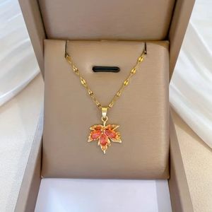 18k gold plated copper necklace with red cz Inlay maple leaf pendant